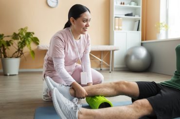 doctor-helping-patient-rehabilitation